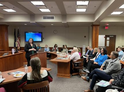 Safe and Healthy Families Problem-Solving Court Judge Elise White addresses audience gathered for annual court anniversary celebration.